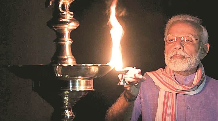 Modi lighting a lamp