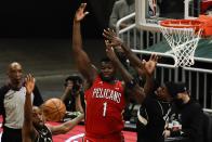 New Orleans Pelicans' Zion Williamson goes after a rebounds with Milwaukee Bucks' Bobby Portis and Khris Middleton during the second half of an NBA basketball game Thursday, Feb. 25, 2021, in Milwaukee. (AP Photo/Morry Gash)