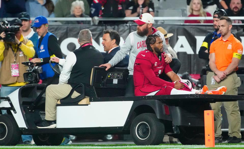 December 12, 2022; Glendale, Ariz; USA; Cardinals quarterback Kyler Murray (1) goes down injured during the first half of a game against the Patriots at State Farm Stadium. 