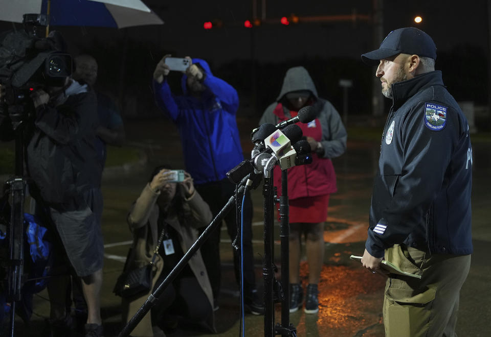 Chad Rogers, public informational officer for Pearland Police Department, gives a statement to the media after a shooting outside Cole's Antique Village and Flea Market, Sunday, Nov. 12, 2023, in Pearland, Texas, near Houston. (Elizabeth Conley/Houston Chronicle via AP)