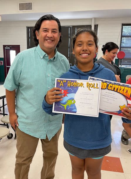 PHOTO: Lexi Rubio is seen smiling next to her teacher Arnie Reyes, who handed her the award certificates that morning. (Rubio Family)