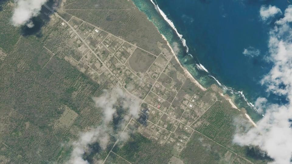 This satellite image provided by Planet Labs PBC, shows Niutoua in Tongatapu, Tonga, on Monday after a huge undersea volcanic eruption.