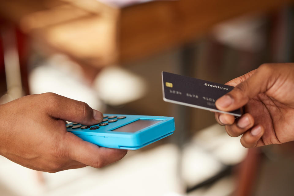 person tapping their card onto a machine