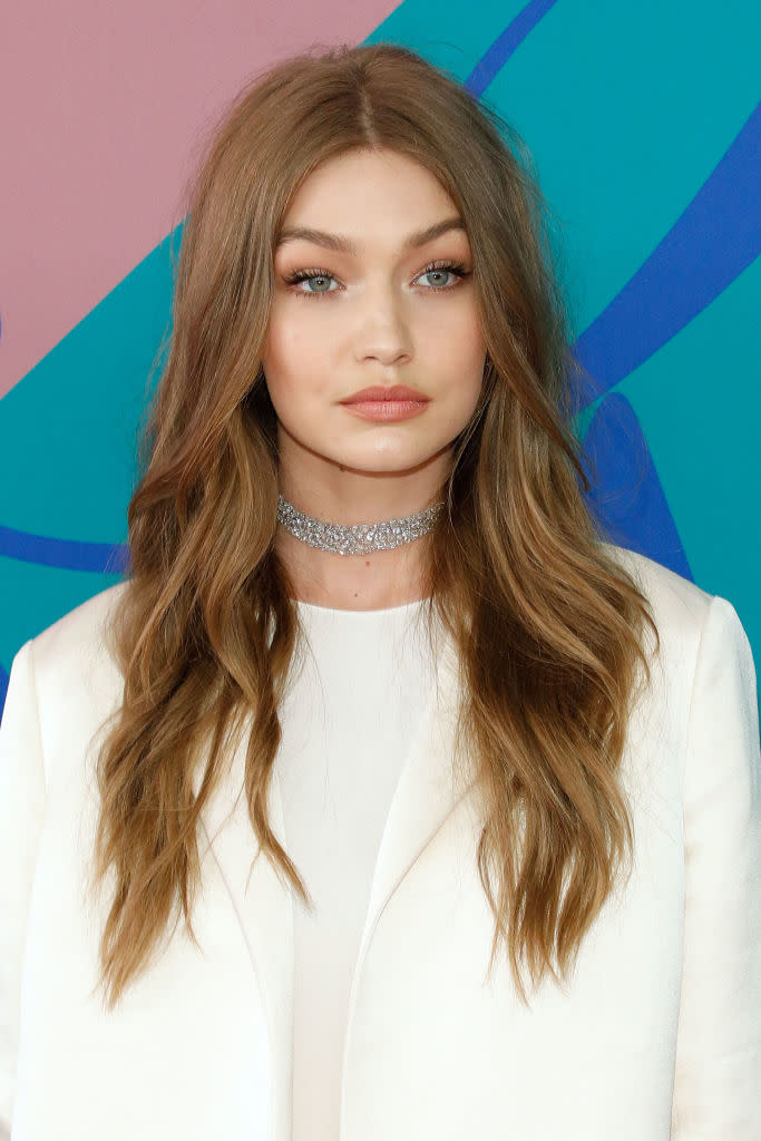 <p>Gigi Hadid shows off stunning, face framing light brown soft waves. (Photo: FilmMagic) </p>