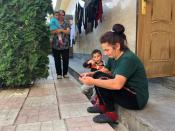 Women take care of their children at a diamond-cutting factory where they found shelter after fleeing the fighting over the breakaway region of Nagorno-Karabakh, in Abovyan