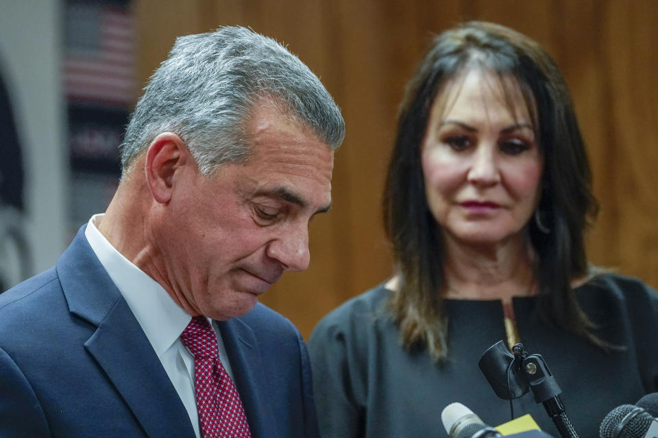 Republican gubernatorial candidate Jack Ciattarelli, left, is joined by his wife Melinda as he speaks during a news conference, Friday, Nov. 12, 2021, in Raritan, N.J. Ciattarelli conceded the race to Democratic Gov. Phil Murphy. (AP Photo/Mary Altaffer)