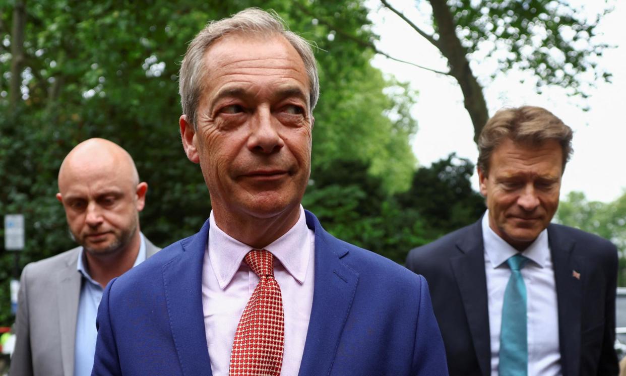 <span>Nigel Farage arrives with the party's chair, Richard Tice (right), for an impromptu press conference in Westminster on Friday.</span><span>Photograph: Hannah McKay/Reuters</span>