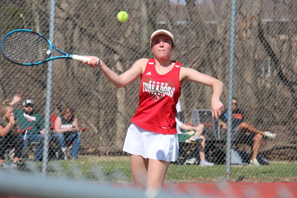 Gracie Gustafson returns the ball during a double match on Monday, April 10, 2023, at McHose Park Tennis Courts in Boone.