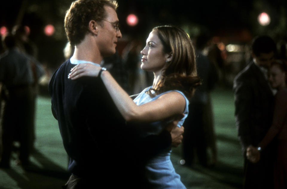 Matthew and J.Lo sharing a dance during an outdoor scene