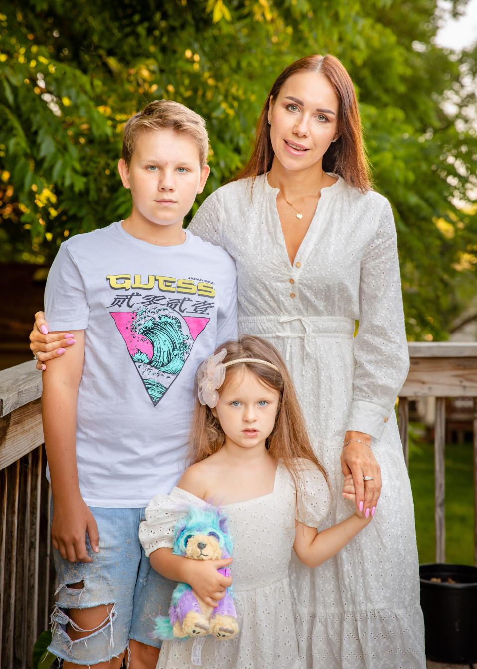 Kateryna Matlakhova stands for a photo with her children, Milana Matlakhova, 4, and Mark Matlakhova, 11, outside a  home in Des Moines, June 23, 2022. The family was living in Bucha, Ukraine, when Russia invaded and is resettling in Des Moines.