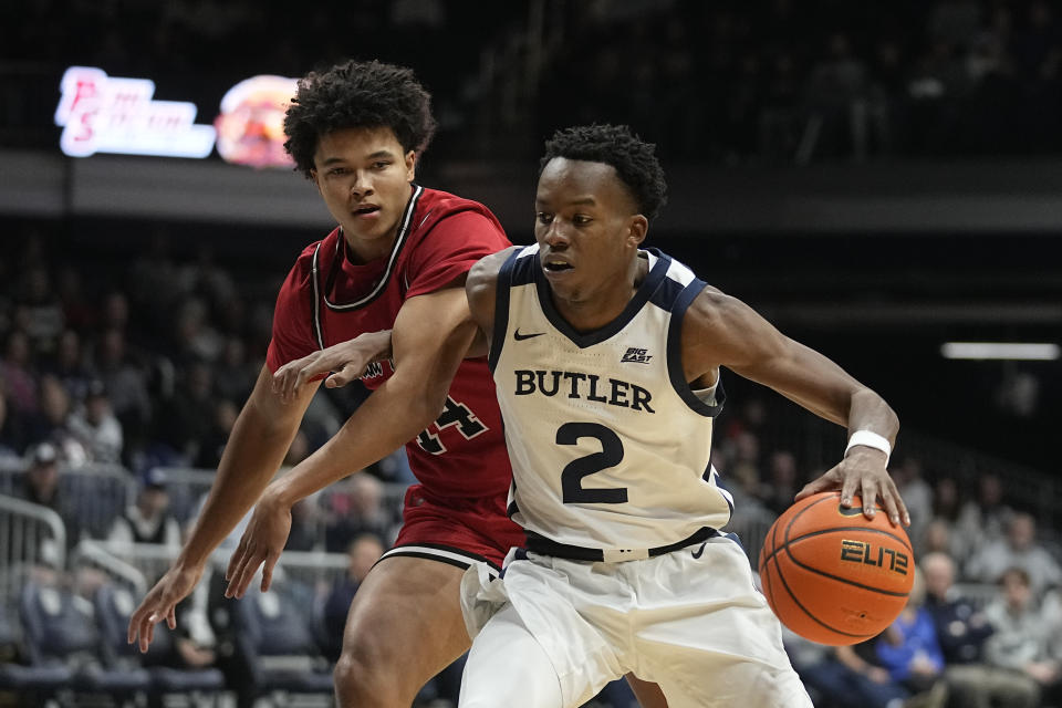 Butler's Eric Hunter Jr. (2) is defended by Saint Francis' Landon Moore (14) during the first half of an NCAA college basketball game Thursday, Nov. 17, 2022, in Indianapolis. (AP Photo/Darron Cummings)