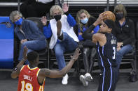 Spectators react as Orlando Magic forward Chuma Okeke (3) catches a pass in front of Atlanta Hawks guard Tony Snell (19) during the second half of an NBA basketball game Wednesday, March 3, 2021, in Orlando, Fla. (AP Photo/Phelan M. Ebenhack)