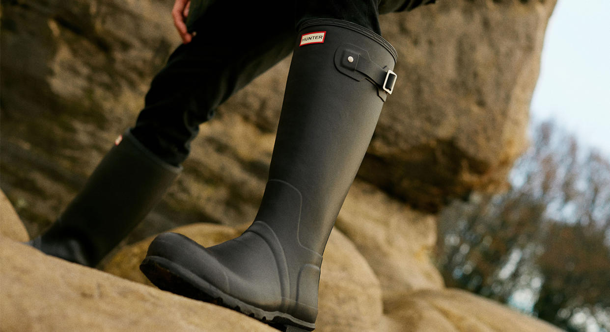 Wellington boots are a fail-safe footwear choice when braving the elements outdoors, especially Hunters' sell-out wellies, which are now back in stock. (Getty Images)