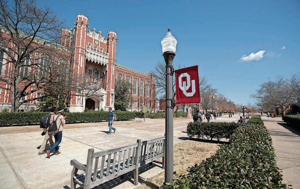 Students walk between classes in front of the Bizzell Memorial Library at the University of Oklahoma in Norman, Oklahoma.