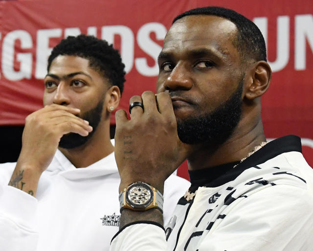 LAS VEGAS, NEVADA - JULY 06:  Anthony Davis (L) and LeBron James of the Los Angeles Lakers arrive at a game between the Lakers and the LA Clippers during the 2019 NBA Summer League at the Thomas &amp; Mack Center on July 6, 2019 in Las Vegas, Nevada. NOTE TO USER: User expressly acknowledges and agrees that, by downloading and or using this photograph, User is consenting to the terms and conditions of the Getty Images License Agreement.  (Photo by Ethan Miller/Getty Images)