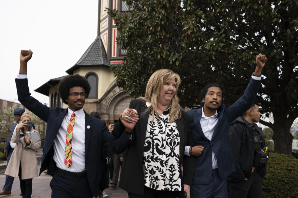 From left, expelled Rep. Justin Pearson, D-Memphis, Rep. Gloria Johnson, D-Knoxville, and expelled Rep. Justin Jones, D-Nashville raise their fists as they walk across Fisk University campus after hearing Vice President Kamala Harris speak, Friday, April 7, 2023, in Nashville, Tenn. Harris came to support the two Democratic lawmakers, who were expelled from the Tennessee State Legislature. (AP Photo/George Walker IV)