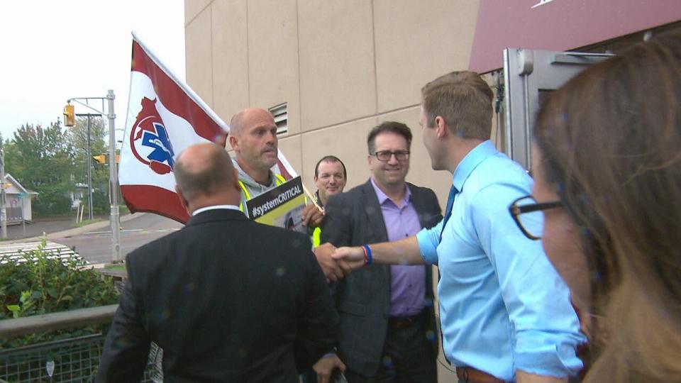 Greg McConaghy, president of CUPE LOCAL 4848, shakes Liberal Leader Brian Gallant's hand as Gallant left a campaign event in Riverview on Wednesday.