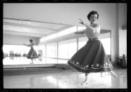 <p>This snapshot of White gliding across an indoor ice rink dates back to 1954. </p>