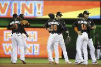 <p>Miami Marlins players celebrate a 7-3 victory during a baseball game over the New York Mets, Monday, Sept. 26, 2016, in Miami. The players wore number sixteen jerseys in honor of pitcher Jose Fernandez who died in a boating accident early Sunday. (AP Photo/Lynne Sladky) </p>