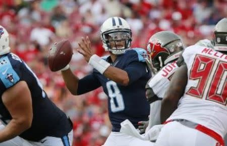 Sep 13, 2015; Tampa, FL, USA; Tennessee Titans quarterback Marcus Mariota (8) throws the ball against the Tampa Bay Buccaneers during the second half at Raymond James Stadium. Mandatory Credit: Kim Klement-USA TODAY Sports