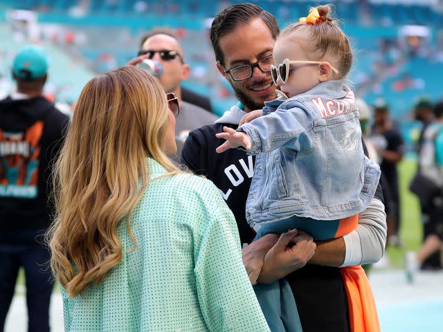 <p>Megan Briggs/Getty </p> Mike McDaniel with his wife Katie and daughter Alya June