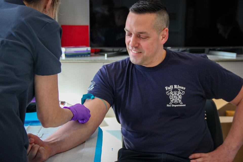 Fall River firefighter Josh Hetzler has blood drawn at Nantucket Fire Department headquarters on March 28, 2022. Hetzler took part in a research study on firefighters and PFAS exposure.