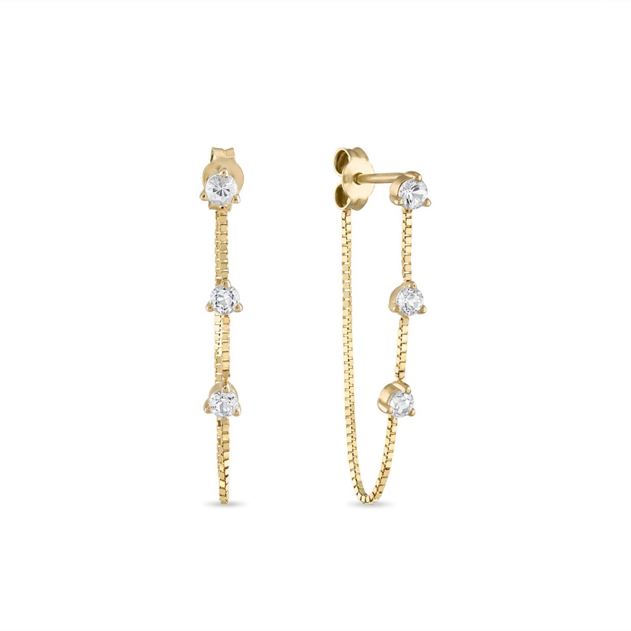 <p><a href="https://skncollections.com/collections/dream-diamonds/products/copy-of-fine-diamond-chain-stud-threader-earring?variant=43696923115674" rel="nofollow noopener" target="_blank" data-ylk="slk:Shop Now;elm:context_link;itc:0;sec:content-canvas" class="link rapid-noclick-resp">Shop Now</a></p><p>Fine White Topaz Dangle Chain Stud Earring</p><p>skncollections.com</p><p>$550.00</p>