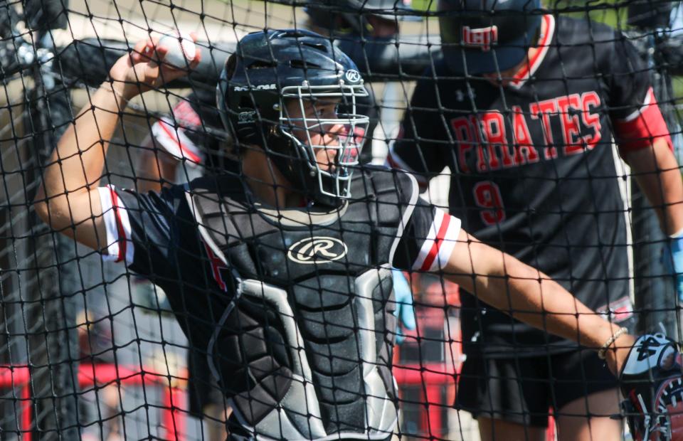 Connor Sanderson handles catching duties during a Lubbock-Cooper baseball practice on Tuesday, May 30, 2023 at First United Park.