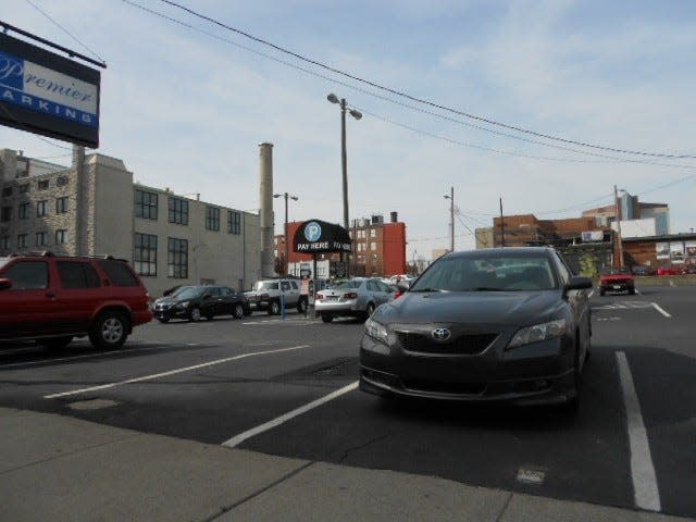 Drivers pass a Premier Parking lot at 121 7th Ave. N. in downtown Nashville.