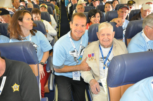 John Savona, as Ford vice president of North American manufacturing, assisted a World War II veteran from Kentucky on an "honor flight" with about 50 veterans headed to Washington, D.C. in 2012. Ford Motor Co. chartered a plane with veterans aged 87 to 93, guardians and medical staff to visit memorials for one day. It was part of the company's ongoing veterans recognition efforts.