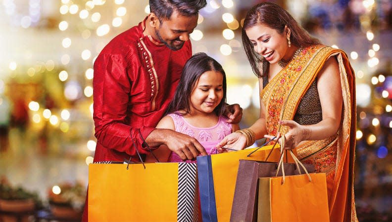 Parents usually gift new clothes to their kids during Diwali.