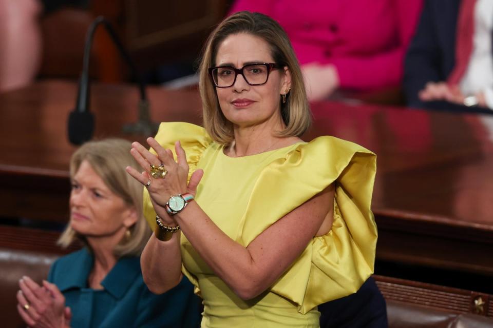 U.S. Senator Kyrsten Sinema applauds during U.S. President Joe Biden's State of the Union address (Getty Images)