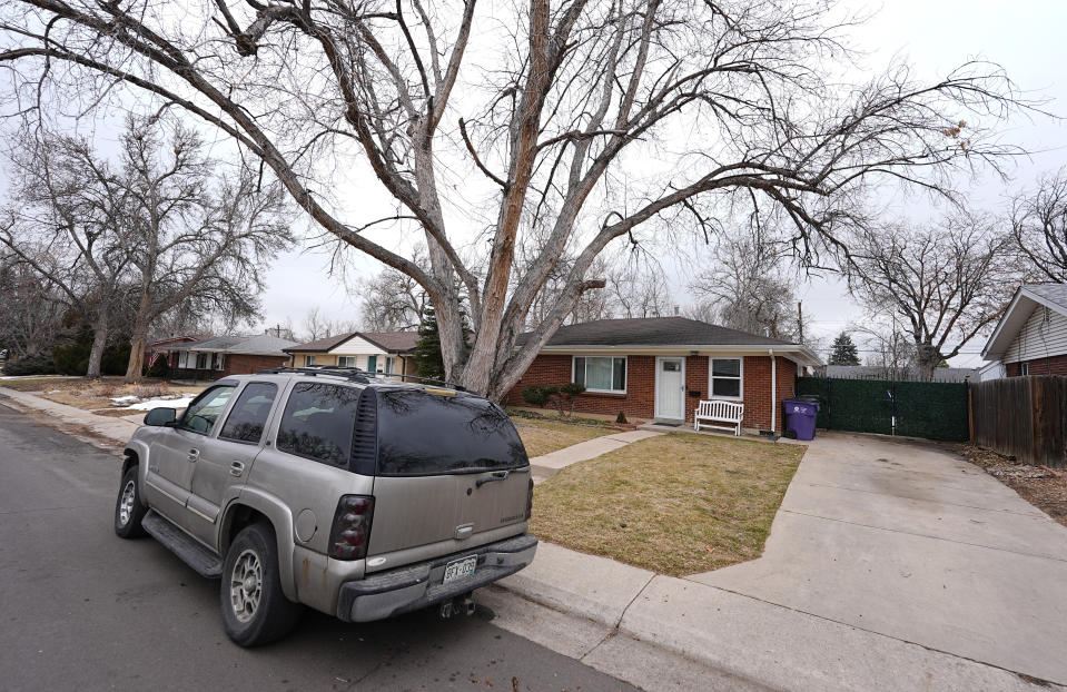 The residence where a former funeral home owner kept a deceased women's body in a hearse for two years as well as the remains of 30 cremated people is shown Friday, Feb. 16, 2024, in southwest Denver. The discovery occurred on Feb. 6 during a court-ordered eviction of the home rented by 33-year-old Miles Harford, who authorities have issued an arrest warrant for. (AP Photo/David Zalubowski)