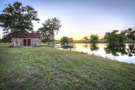 <p>Talk about a picture perfect country getaway: This custom built 336-square-foot cabin sits on 24 sprawling acres in West Point, Texas—just steps from its own four-acre constant flow lake, tiny lake house, and wooden pier. The rustic wood-paneled interior features a living space, full kitchen, bathroom, and two lofted bedrooms, all housed under a corrugated metal roof. </p><p><a class="link " href="http://www.estately.com/listings/info/530-justice-rd" rel="nofollow noopener" target="_blank" data-ylk="slk:SEE INSIDE;elm:context_link;itc:0;sec:content-canvas">SEE INSIDE</a></p>