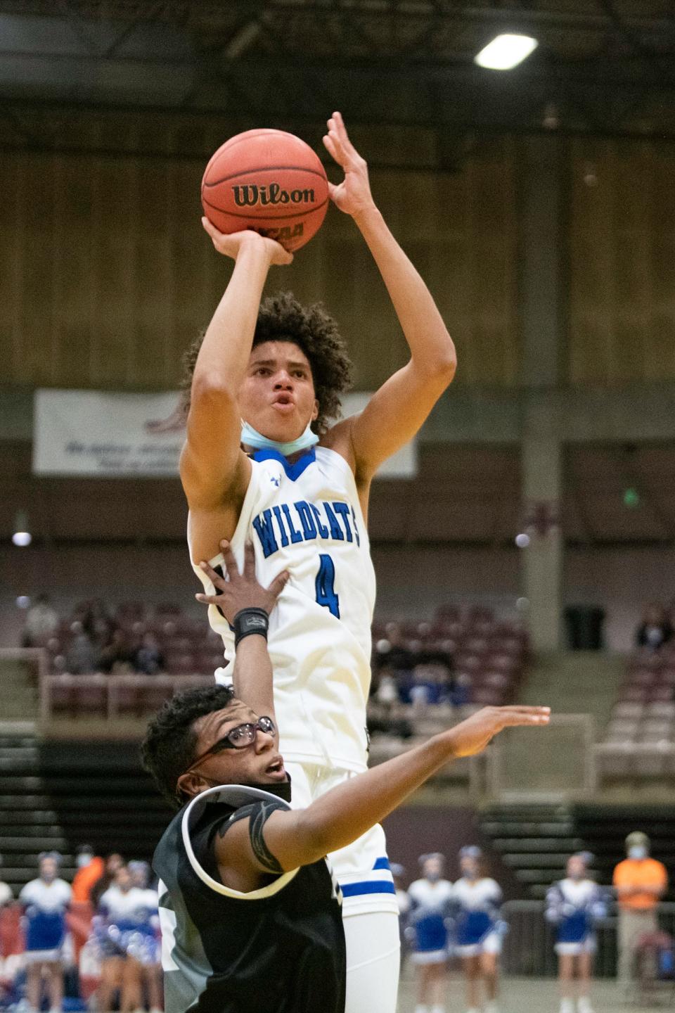 Pueblo Central's Kadyn Betts goes up for a jump shot in from of Pueblo South's Tarrance Austin on Tuesday, Feb. 15, 2022 at the Southwest Motors Events Center.