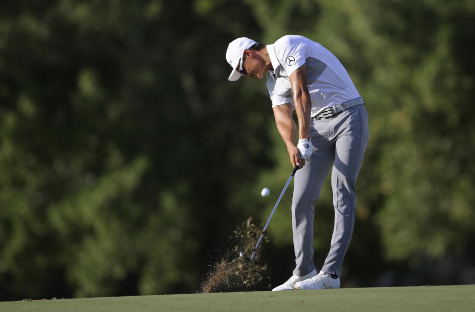 Haotong Li from China plays a shot on the 16th hole during the first round of the DP World Tour Championship golf tournament in Dubai, United Arab Emirates, Thursday, Nov. 15, 2018. (AP Photo/Kamran Jebreili)