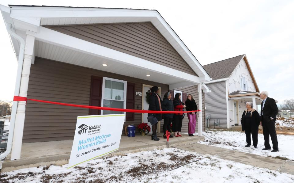 A ceremony for the latest new homeowner to move into a house built by Habitat for Humanity of St. Joseph County takes place Wednesday, Dec. 20, 2023, on Yearwood Lane in Mishawaka. Ryan Durham received the keys to her new house, one of 12 that were built in 2023, according to Habitat officials.