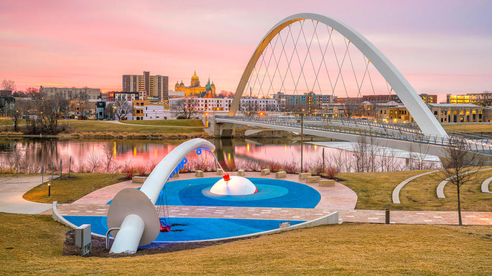 Des Moines Iowa skyline with bridge at sunset