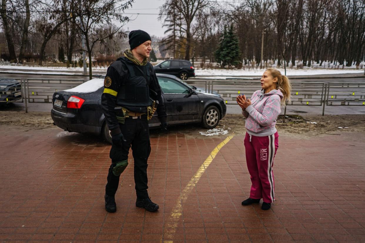 Andriy Khlyvnyuk, a Ukrainian rockstar who joined the armed forces, is greeted by a fan in Kyiv