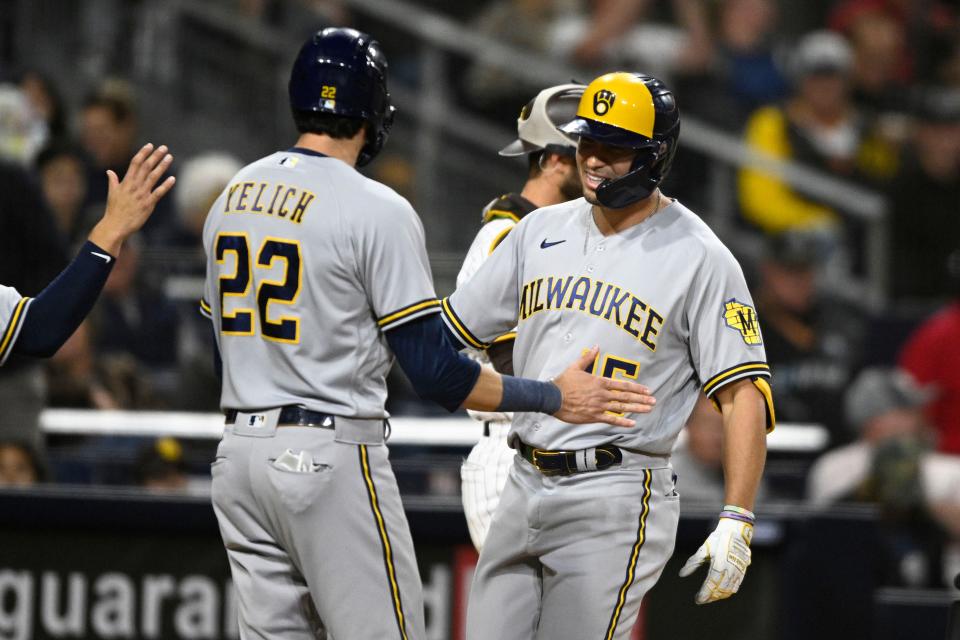 Brewers rightfielder Tyrone Taylor is greeted by Christian Yelich after he belted a three-run home run against the Padres in the sixth inning Tuesday.