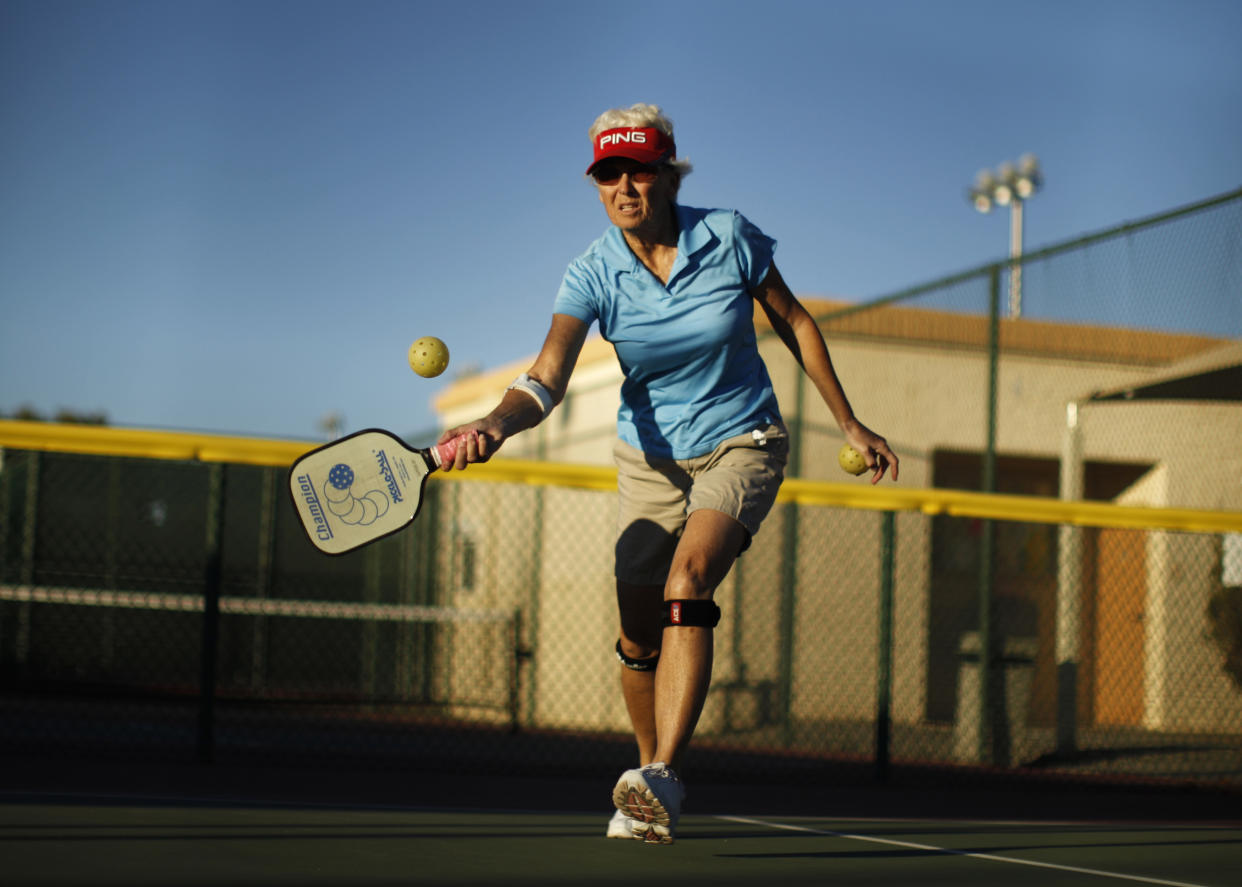 Barb Wald, 66, plays pickleball in Sun City, Arizona, January 5, 2013. Sun City was built in 1959 by entrepreneur Del Webb as America?s first active retirement community for the over-55's. Del Webb predicted that retirees would flock to a community where they were given more than just a house with a rocking chair in which to sit and wait to die. Today?s residents keep their minds and bodies active by socializing at over 120 clubs with activities such as square dancing, ceramics, roller skating, computers, cheerleading, racquetball and yoga. There are 38,500 residents in the community with an average age 72.4 years. Picture taken January 5, 2013.  REUTERS/Lucy Nicholson (UNITED STATES - Tags: SOCIETY)

ATTENTION EDITORS - PICTURE 12 OF 30 FOR PACKAGE 'THE SPORTY SENIORS OF SUN CITY'
SEARCH 'SUN CITY' FOR ALL IMAGES