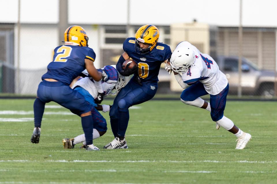 Riley's Dominick Jolley (0) runs with the ball for yardage during the South Bend Adams-South Bend Riley high school football game on Friday, September 02, 2022, at Jackson Field in South Bend, Indiana.