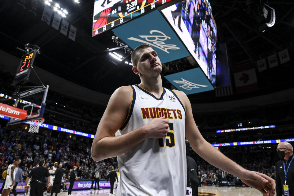 DENVER, CO - NOVEMBER 8: Nikola Jokic (15) of the Denver Nuggets is ejected after striking Markieff Morris (8) of the Miami Heat with a retaliatory blow during the fourth quarter of Denver