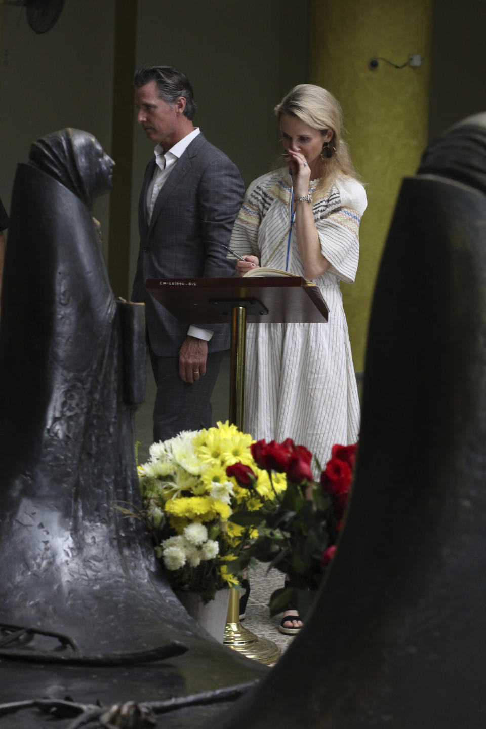 California Gov. Gavin Newsom and his wife, Jennifer Siebel Newsom visit the tomb of Archbishop Oscar Romero at Metropolitan Cathedral in San Salvador, El Salvador, Sunday, April 7, 2019. Newsom visited the tomb of Archbishop Romero, the Salvadoran priest assassinated in 1980 due to his advocacy for human rights and the poor. (AP Photo/Salvador Melendez, Pool)