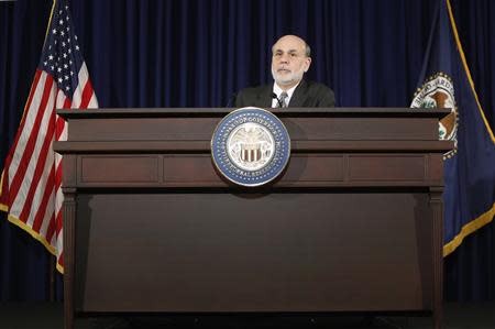 U.S. Federal Reserve Chairman Ben Bernanke responds to reporters during his final planned news conference before his retirement, at the Federal Reserve Bank headquarters in Washington, December 18, 2013. REUTERS/Jonathan Ernst