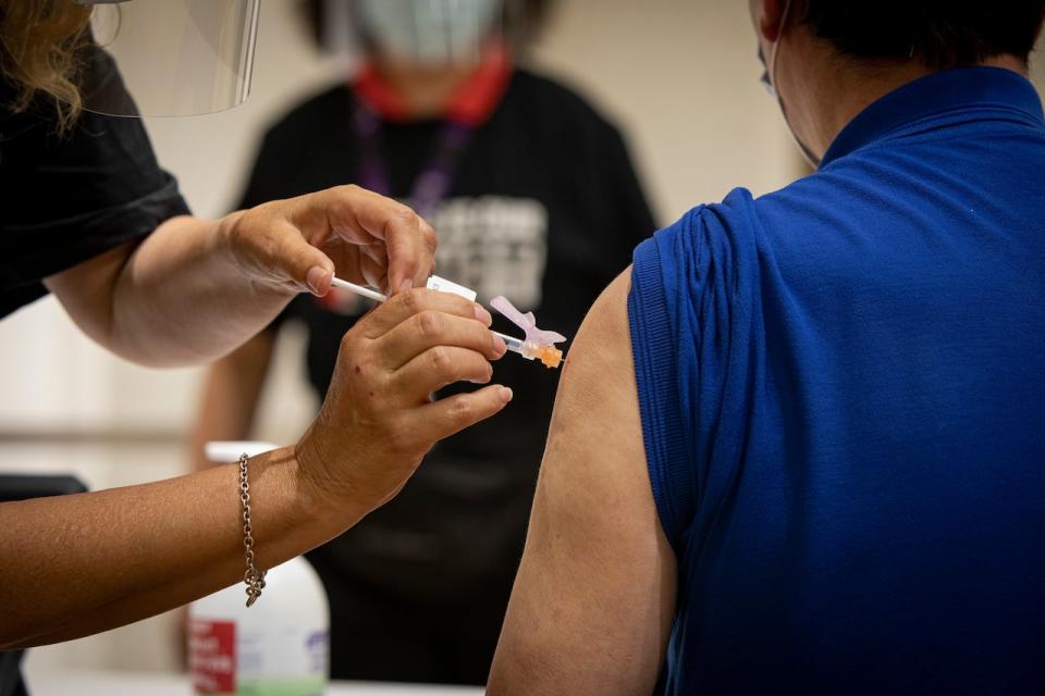COVID-19 vaccines are available to British Columbians but some are having to wait weeks for an appointment. (Evan Mitsui/CBC - image credit)