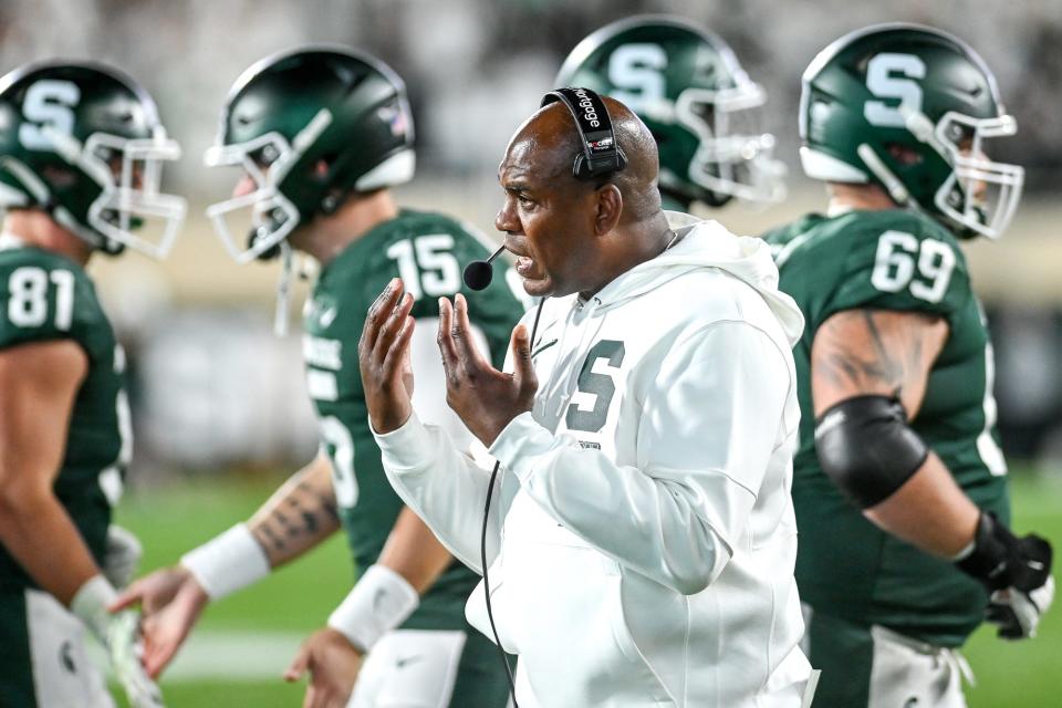 Michigan State's head coach Mel Tucker talks with players during the fourth quarter in the game against Nebraska on Saturday, Sept. 25, 2021, at Spartan Stadium in East Lansing.