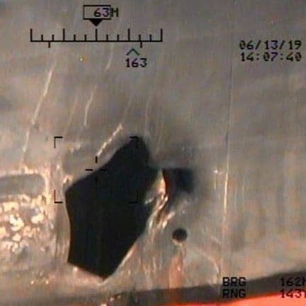  U.S. Pentagon in Washington releases handout imagery that it says shows damage from mines to commercial ships in Gulf of Oman - Credit: Reuters