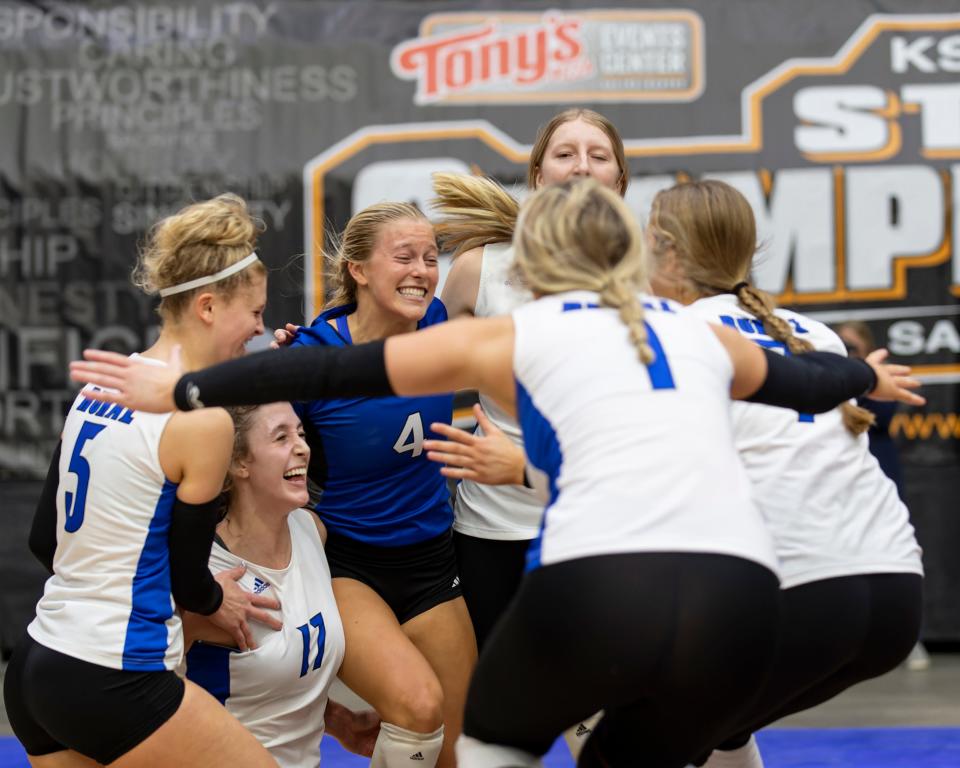 Washburn Rural volleyball players celebrate after winning the state title on Saturday. It was the school's eighth volleyball championship.