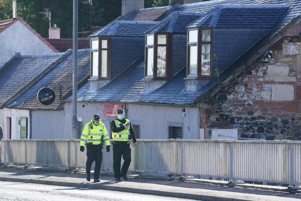 Police in New Cumnock, East Ayrshire, during the search (Andrew Milligan/PA) (PA Wire)